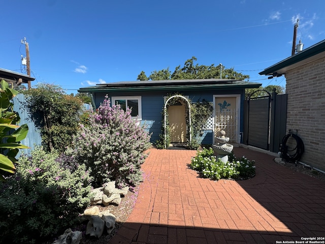 doorway to property with a patio