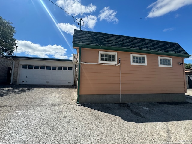 view of property exterior featuring a garage