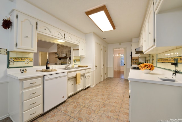 kitchen featuring white dishwasher, sink, light tile patterned flooring, white cabinets, and tasteful backsplash