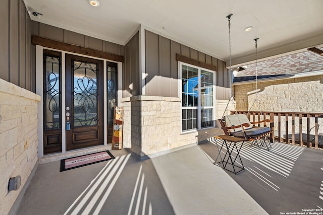 doorway to property with covered porch