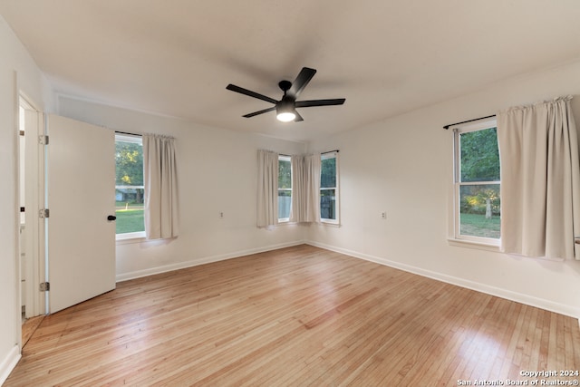 empty room with light hardwood / wood-style flooring and ceiling fan