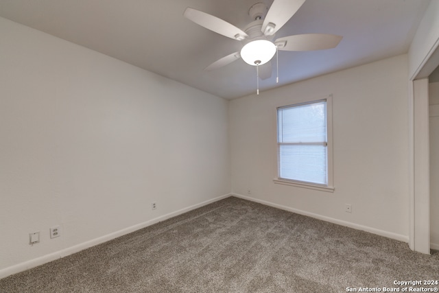 spare room with ceiling fan and carpet floors