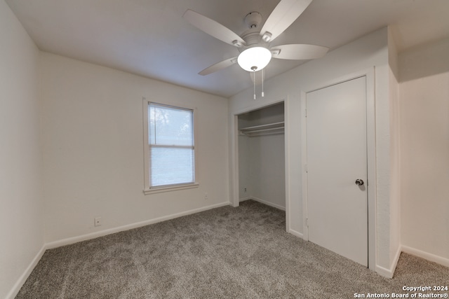 unfurnished bedroom with light colored carpet, ceiling fan, and a closet