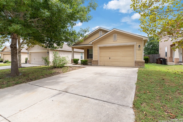 view of front of house featuring a front yard and a garage