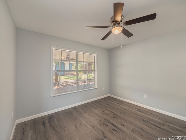 unfurnished room with ceiling fan and dark hardwood / wood-style floors