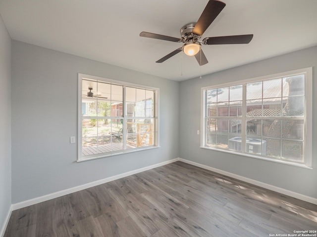 empty room featuring hardwood / wood-style flooring and ceiling fan