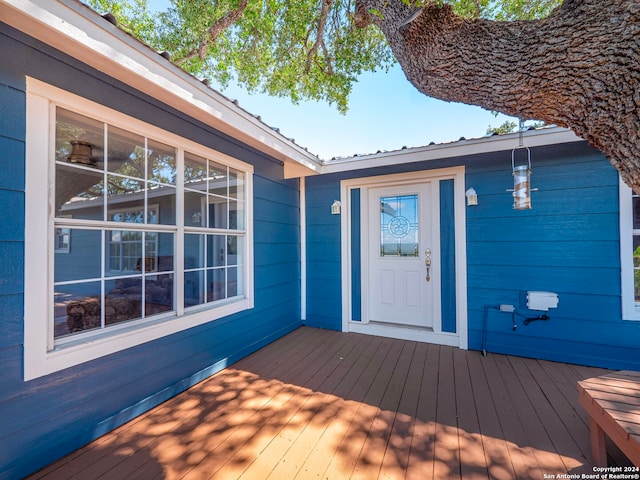 property entrance with a wooden deck