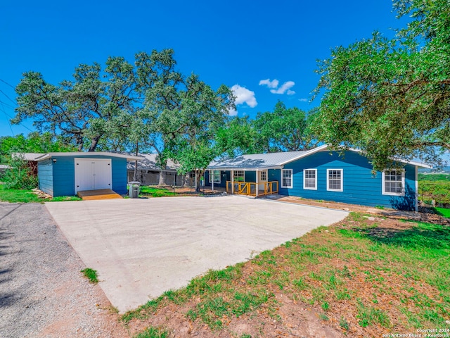 single story home with a shed