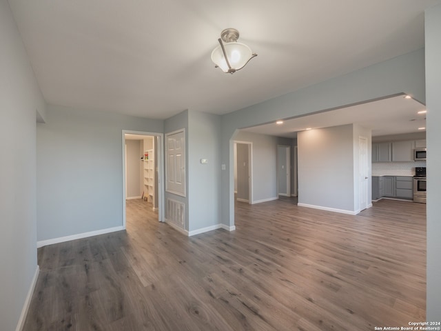 unfurnished room featuring hardwood / wood-style floors