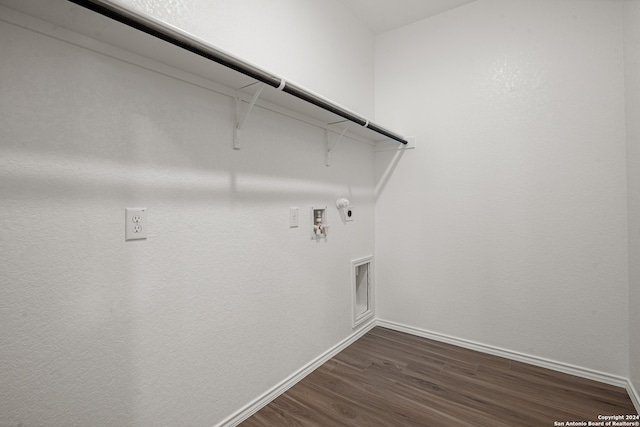 laundry room featuring hookup for a gas dryer, dark wood-type flooring, washer hookup, and hookup for an electric dryer