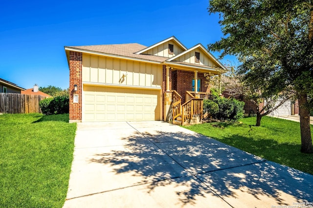 ranch-style house featuring a front yard and a garage