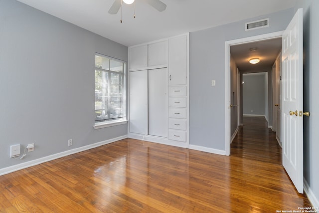 unfurnished bedroom with wood-type flooring and ceiling fan