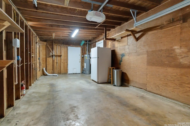 basement featuring white refrigerator and water heater