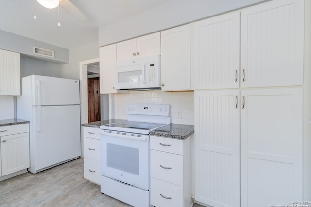 kitchen featuring white cabinets, backsplash, white appliances, dark stone counters, and ceiling fan