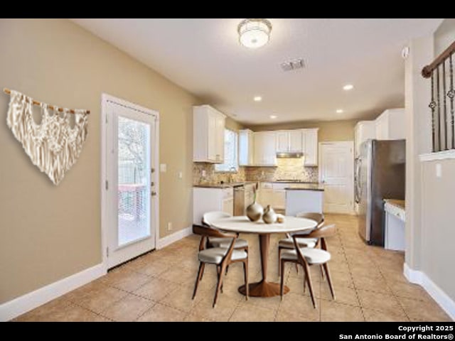 dining space with baseboards, visible vents, and recessed lighting