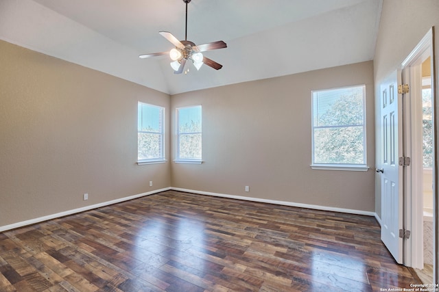 unfurnished room with ceiling fan, lofted ceiling, and dark hardwood / wood-style flooring