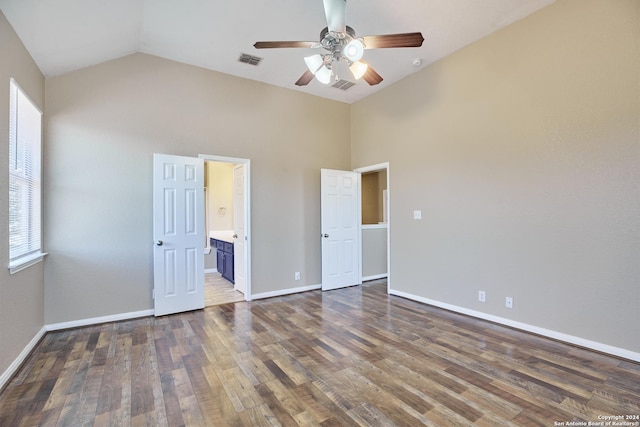 unfurnished bedroom with wood finished floors, visible vents, baseboards, and multiple windows