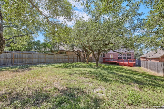 view of yard with a wooden deck