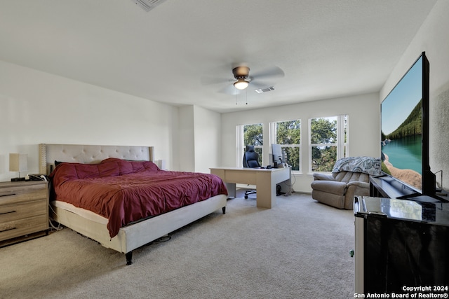 carpeted bedroom with ceiling fan