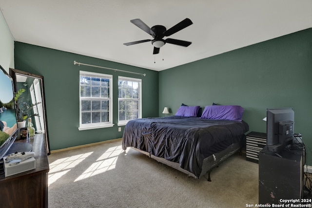 bedroom featuring ceiling fan and light colored carpet