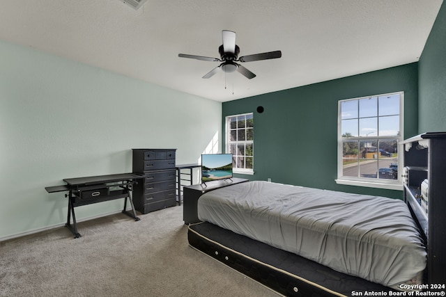 bedroom featuring ceiling fan and carpet floors