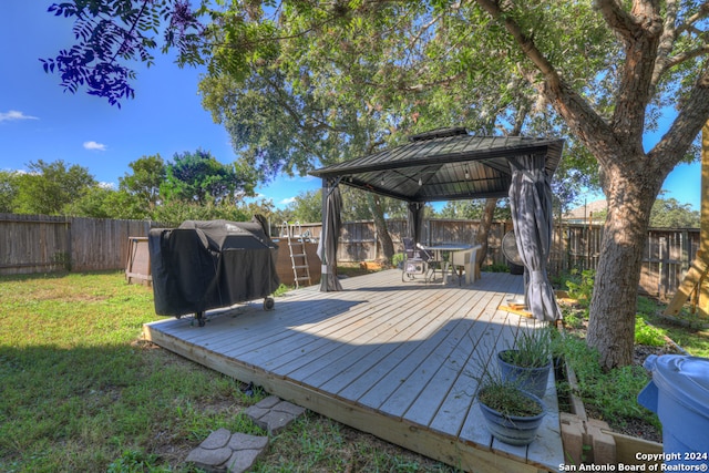 deck with a lawn, a gazebo, and area for grilling