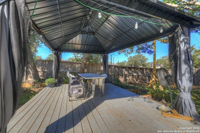 wooden deck featuring a gazebo