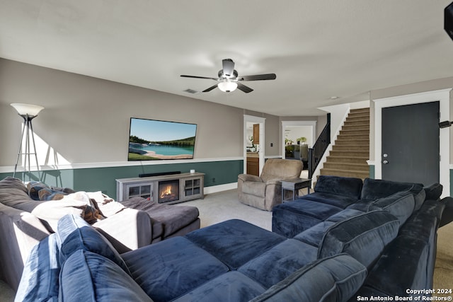 living room with carpet floors and ceiling fan