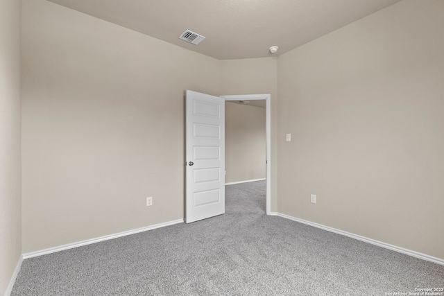 spare room featuring carpet flooring