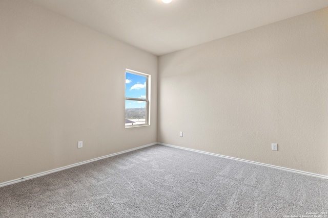 unfurnished room featuring carpet flooring