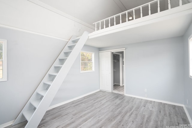 staircase featuring hardwood / wood-style floors