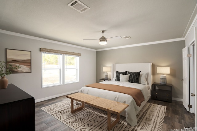 bedroom with crown molding, ceiling fan, and dark hardwood / wood-style floors