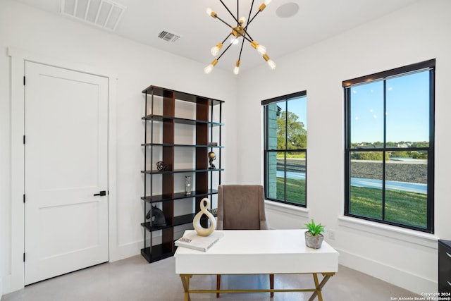 home office with plenty of natural light and an inviting chandelier