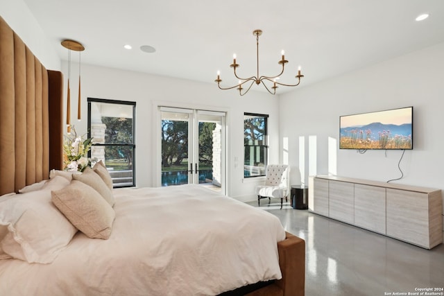 bedroom with concrete flooring, a notable chandelier, access to outside, and french doors