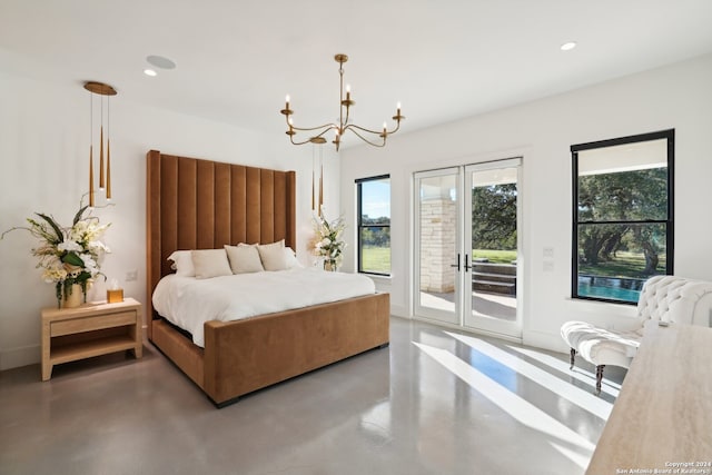 bedroom with access to exterior and a chandelier