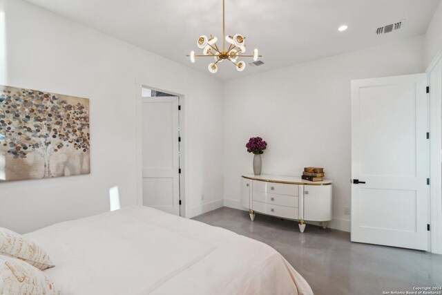 bedroom with a notable chandelier