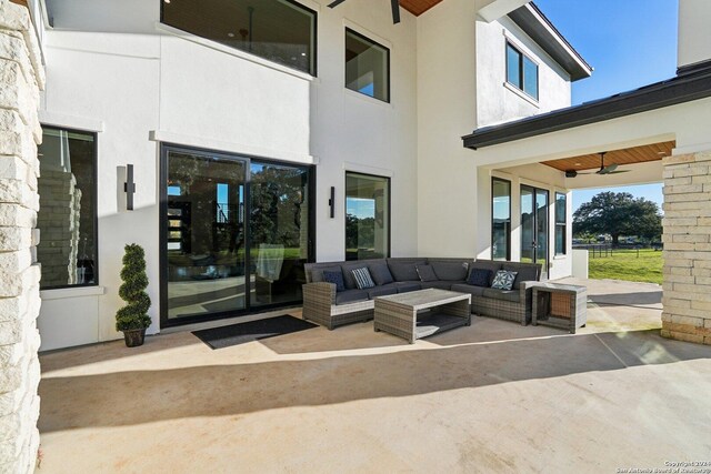 view of patio with ceiling fan and an outdoor hangout area