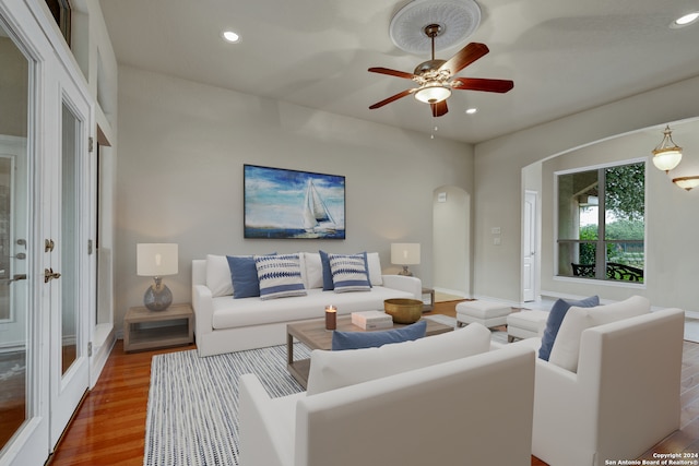 living room with ceiling fan and wood-type flooring