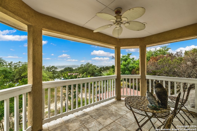 exterior space featuring ceiling fan