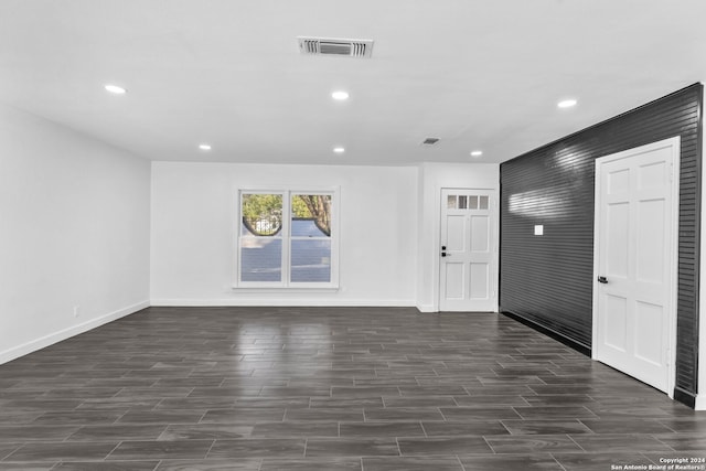 spare room with dark wood-type flooring