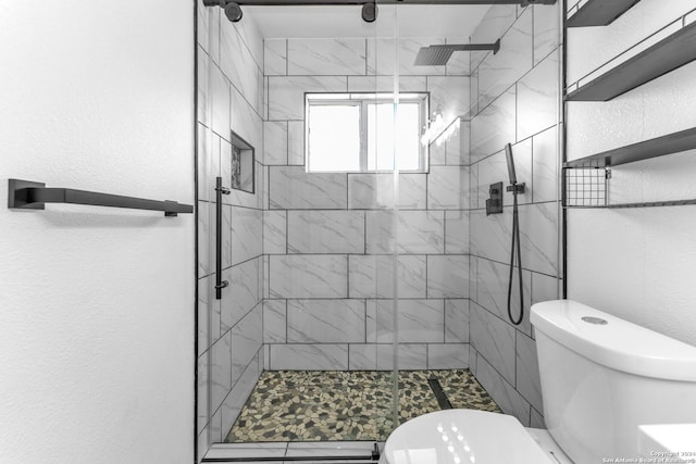 bathroom with an enclosed shower and toilet