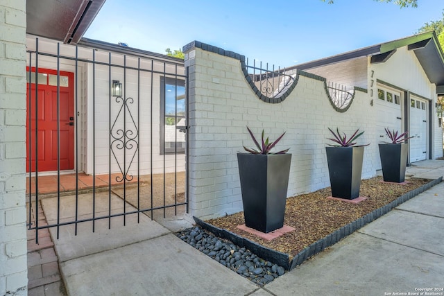 view of gate featuring a garage