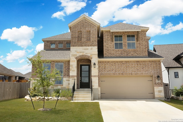 view of front of home featuring a garage and a front lawn