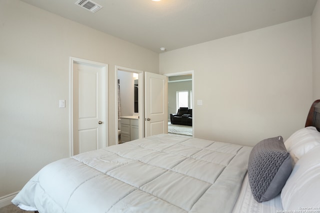 bedroom featuring ensuite bath