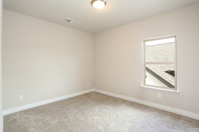 spare room featuring carpet flooring