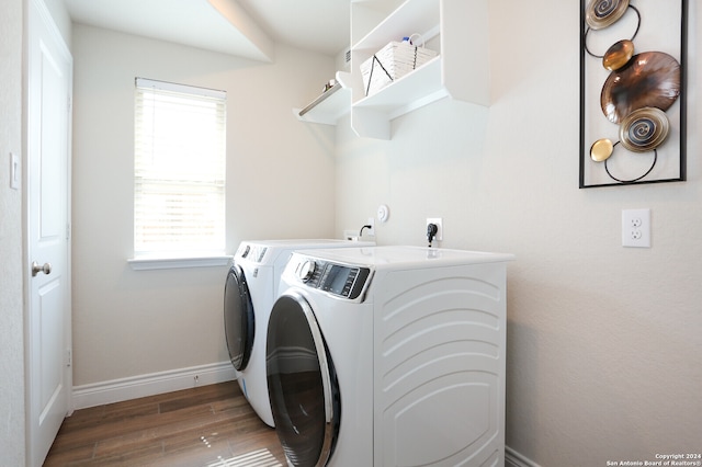 laundry room featuring separate washer and dryer and dark hardwood / wood-style flooring