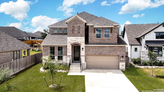 view of front facade featuring a garage and a front lawn