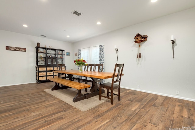 dining space featuring dark hardwood / wood-style flooring