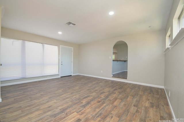 empty room featuring dark hardwood / wood-style flooring