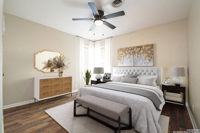 bedroom with dark hardwood / wood-style flooring and ceiling fan